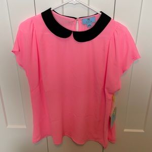 Pink shirt with black collar